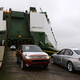 A BMW car (right) destined for export overseas is loaded onto ship on January 22, 2014 in Bremerhaven, Germany while Mitsubishi car produced in Japan is leaving the vessel. Bremerhaven is Europe’s biggest port for car exports, with over 2.1 million cars having passed through in 2013. Much of the German economy relies on exports, a fact criticized by the U.S. and other governments, who argue that stronger German domestic demand would help a global economic recovery.